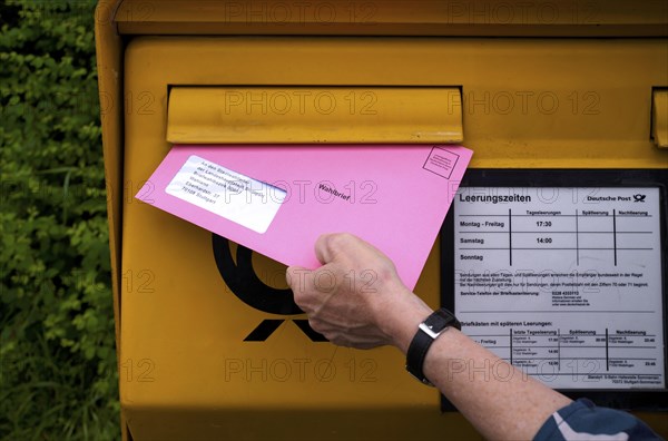 Postal ballot, letterbox, insert ballot paper envelope, light red, pink, European elections,