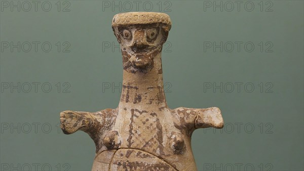 Ancient sculpture of a human-like body with green background, interiors, Archaeological Museum, Old