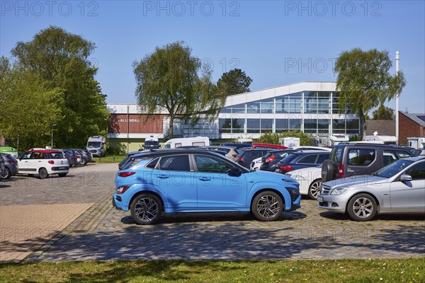 Indoor swimming pool with car park in Niebuell, Nordfriesland district, Schleswig-Holstein,