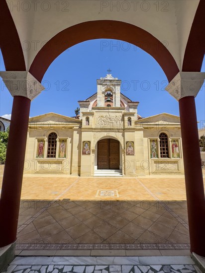 View through archway to main entrance portal of orthodox church monastery church Zoodochos Pege in