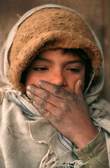 Shy boy working as a tea shop servant, Northern Pakistan