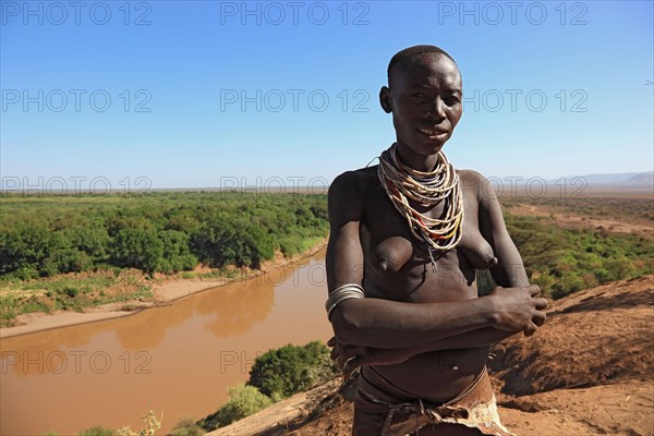 South Ethiopia, Omo region, Omo river landscape, proud woman of the Karo people with necklace,