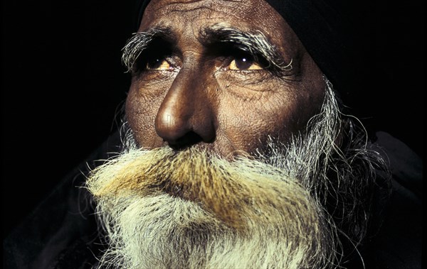 Portrait of a fakir, muslim ascetic near the Moinuddin Chishti mausoleum, Dargah sharif at Ajmer,