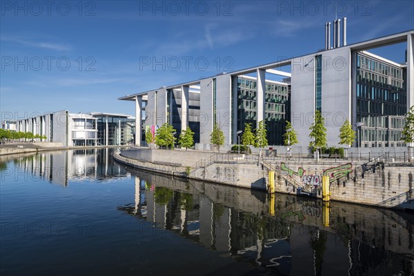 Reichstag, Paul-Loebe-Haus and Marie-Elisabeth-Lueders-Haus reflected in the Spree at sunrise,