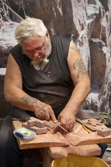 Pipestone, Minnesota, A Native American makes pipes from pipestone at Pipestone National Monument.