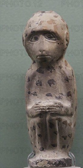 Aryballos, Ceramic vessel, Ancient sculpture of a monkey with dotted pattern against a green