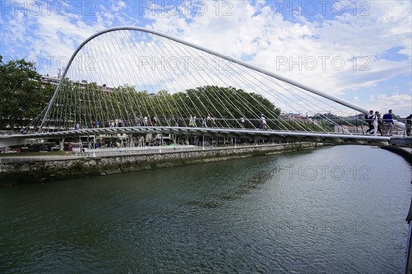 Pedestrian bridge Zubizuri, White Bridge, Bilbao, Modern pedestrian bridge over a river Nervion,