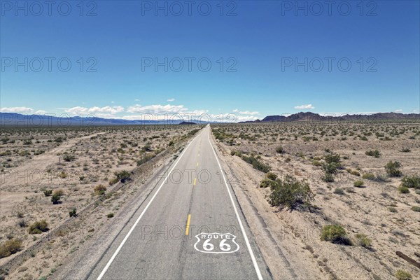 Drone shot of Route 66 with Route 66 sign on the road, Mojave Desert, California