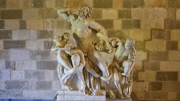 Copy of the Laocoon Group, marble sculpture depicting a dynamic mythological battle, interior view,