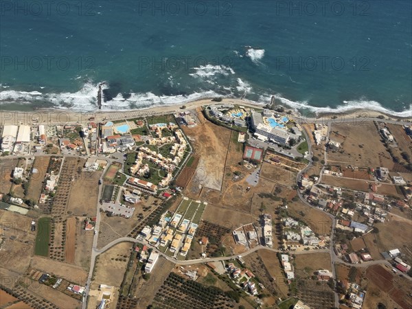 Aerial view of beach sea beach section with hotel complexes near Heraklion, Heraklion, Crete,