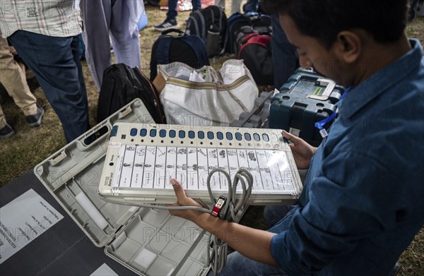 Barpeta, India. 6 May 2024. Polling officials check Electronic Voting Machines (EVMs) before