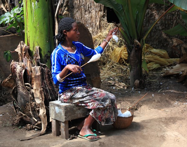 South Ethiopia, among the Dorze people, woman with spindle, spinning cotton, craftsmanship,