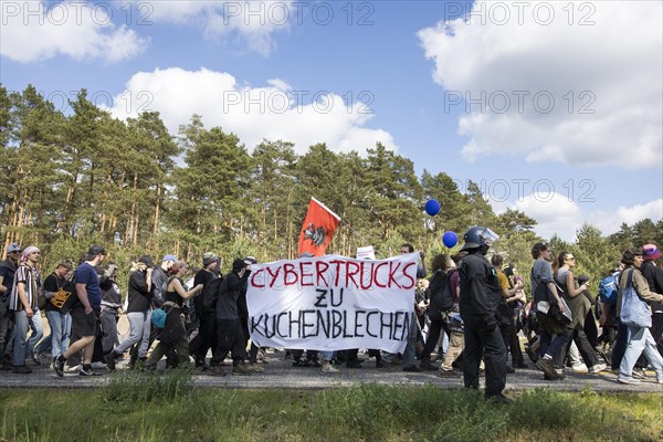 Participants with banners Cybertrucks to cake tins at the demonstration Water. Forest. Justice