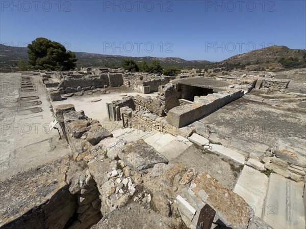 View of foundation walls of in antiquity former storehouse with storerooms workshops building for