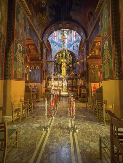 Chancel interior of orthodox church with in the background chandelier chandelier under dome of