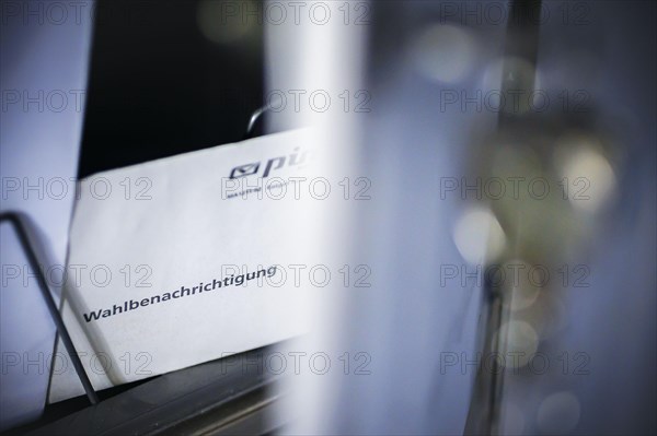Symbolic photo: A polling card lying in a letterbox. Berlin, 14 May 2024