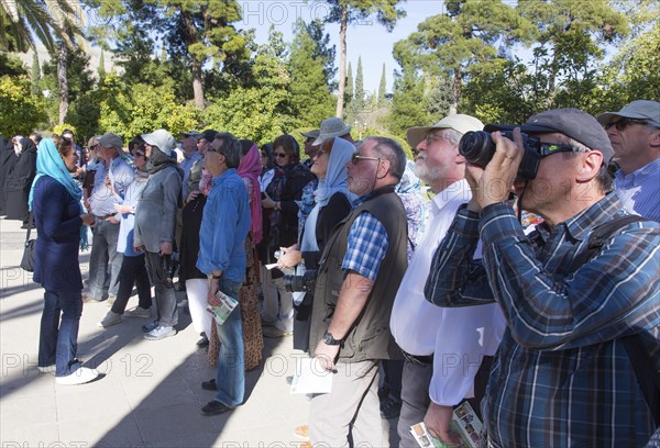 Tourists visit a tropical garden in Shiraz, Shiras, Iran on 03/04/2015