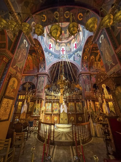Chancel interior of orthodox church with in the background chandelier chandelier under dome of