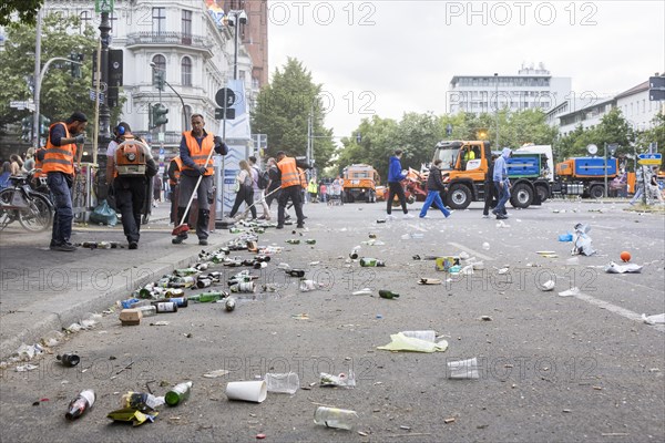 Employees of a cleaning service clean Gneisenaustrasse after the street parade of the 26th Carnival