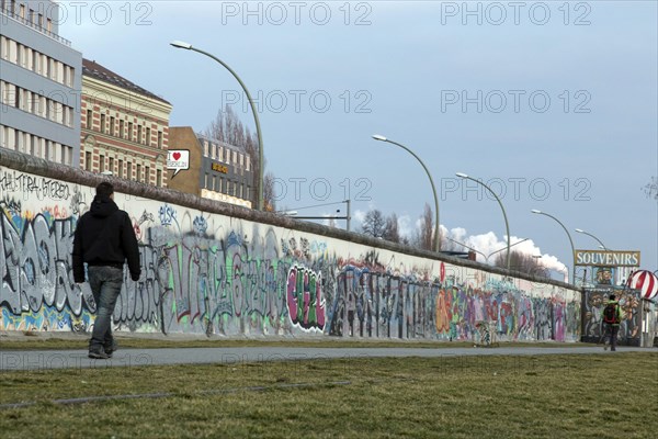 A man walks along the remains of the Berlin Wall, the East Side Gallery, 20/02/2014