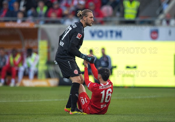 Football match, The exhausted Kevin SESSA 1. FC Heidenheim right, still sitting on the pitch, is