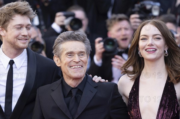 Cannes, France, 17.5.2024: Joe Alwynbei, Willem Dafoe and Emma Stone at the premiere of Kinds of