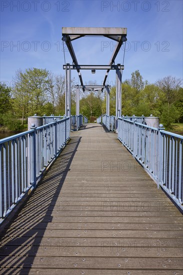 Blue bridge over the Westersielzug in Friedrichstadt, district of Nordfriesland,