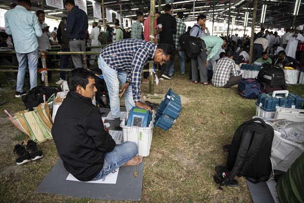 Barpeta, India. 6 May 2024. Polling officials collects Electronic Voting Machines (EVMs) and Voter
