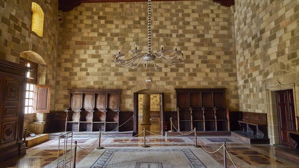 Elegant room with chandelier and antique wooden furniture, interior view, Grand Master's Palace,