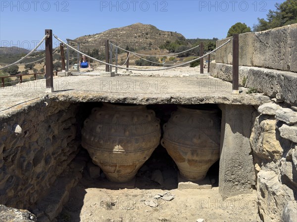 View into historical storeroom below present floor level with two large decorated clay vessels