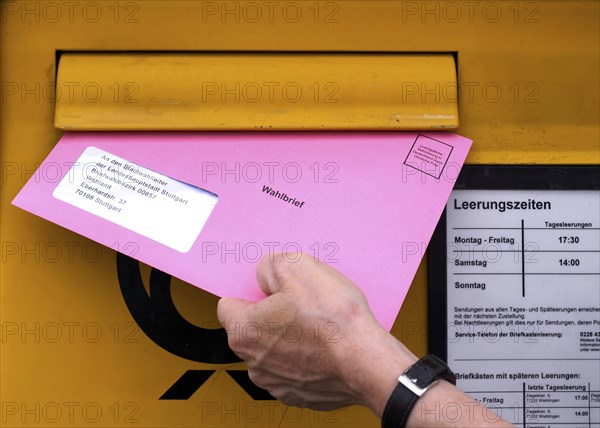 Postal ballot, letterbox, insert ballot paper envelope, light red, pink, European elections,