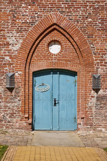 Entrance door to St Laurentius Church in Toenning, North Friesland district, Schleswig-Holstein,