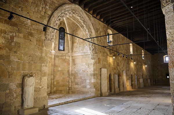 Former Great Hospital of the Order of St John, A long arcade with ornate stone walls and sculptures
