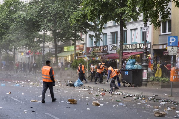 Employees of a cleaning service clean Gneisenaustrasse after the street parade of the 26th Carnival