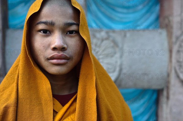 Buddhist novice at Bodhgaya, India. Bodhgaya is the place where the Buddha has attained