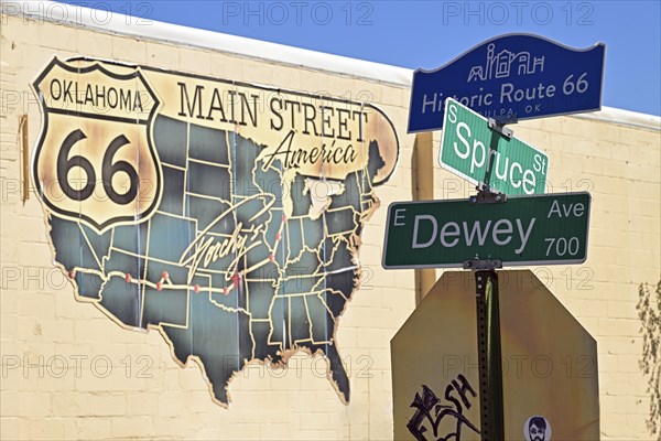 Street sign with road map on the wall of a house on Route 66, Tulsa Oklahoma