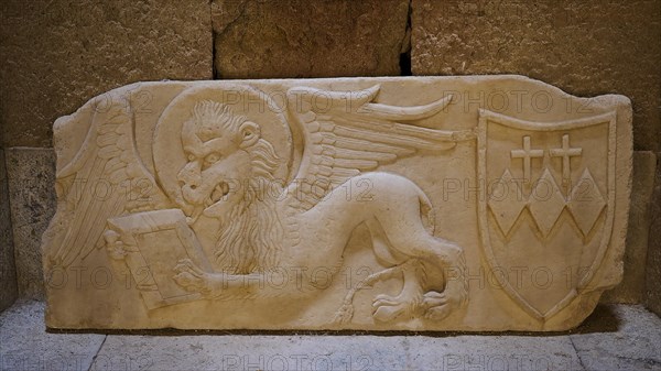 Lion of St Mark, Crispi family crest, A stone relief shows a winged lion and a coat of arms with