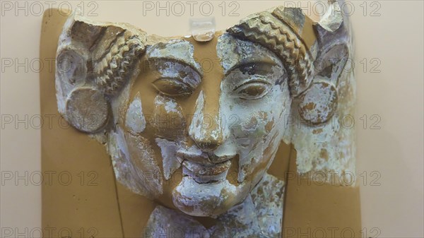 Female terracotta bust, A damaged ancient stone relief of a female face, Interior, Archaeological