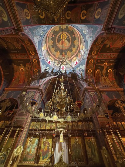Chancel interior of orthodox church with in the background chandelier chandelier under dome of
