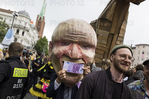 Dancer dressed as an investor from the 100% Tempelhofer Feld group at the street parade of the 26th