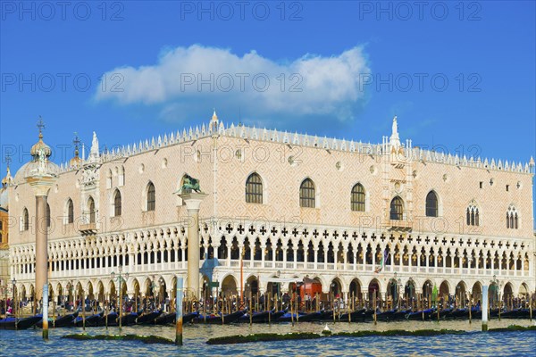 Ducal Palace on Saint Mark Square and Grand Canal with Many Gondola in a Sunny Day in Venice,