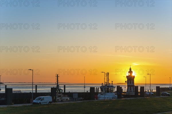 Pingelturm, historic lighthouse in the harbour, atmospheric, golden, beautiful sunset, silhouette