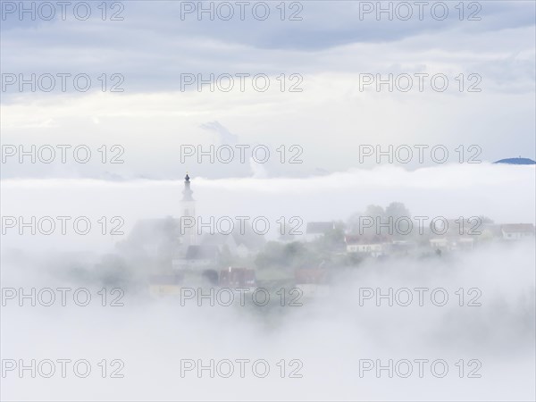 Church rises out of the morning mist, Frauenberg pilgrimage church, near Leibnitz, Styria, Austria,