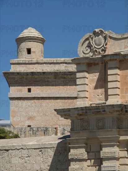 A tower and castle walls of an old castle under a blue sky, Historic buildings with beautiful