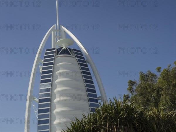 The Burj Al Arab Hotel in Dubai, known for its iconic design and luxurious facilities, dubai, arab