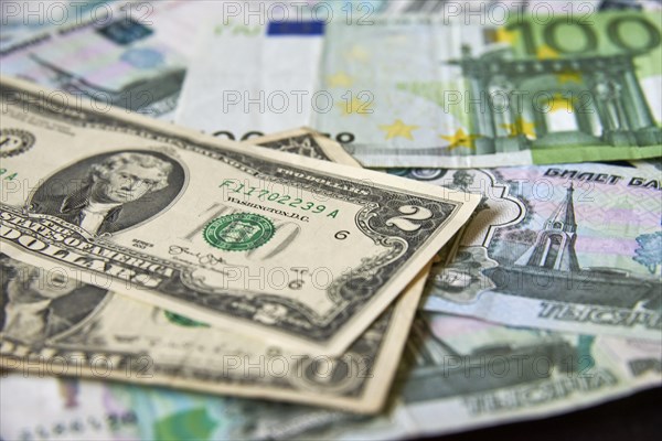 Background of paper bills dollars, euros and rubles. Currency exchange rate