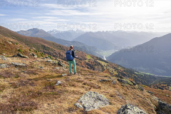 Mountaineer in the mountains in autumn, Venet crossing, Oetztal Alps, Tyrol, Austria, Europe