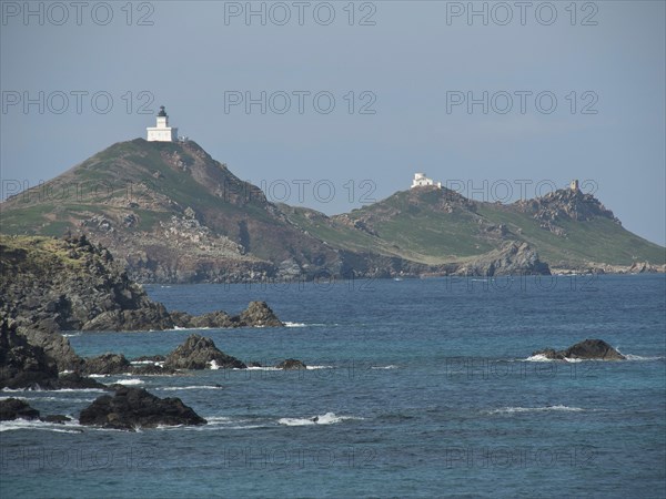 Coastal landscape with two islands and lighthouses, surrounded by rocks and sea, Corsica, Ajaccio,