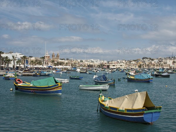 Panorama of a coastal town with colourful boats on the sea and clear sky, colourful boats in a