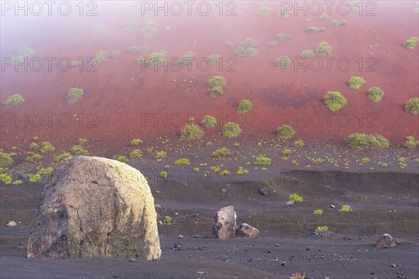 Lava bomb in front of Caldera Colorada, Parque Natural de Los Volcanes, near Masdache, Lanzarote,